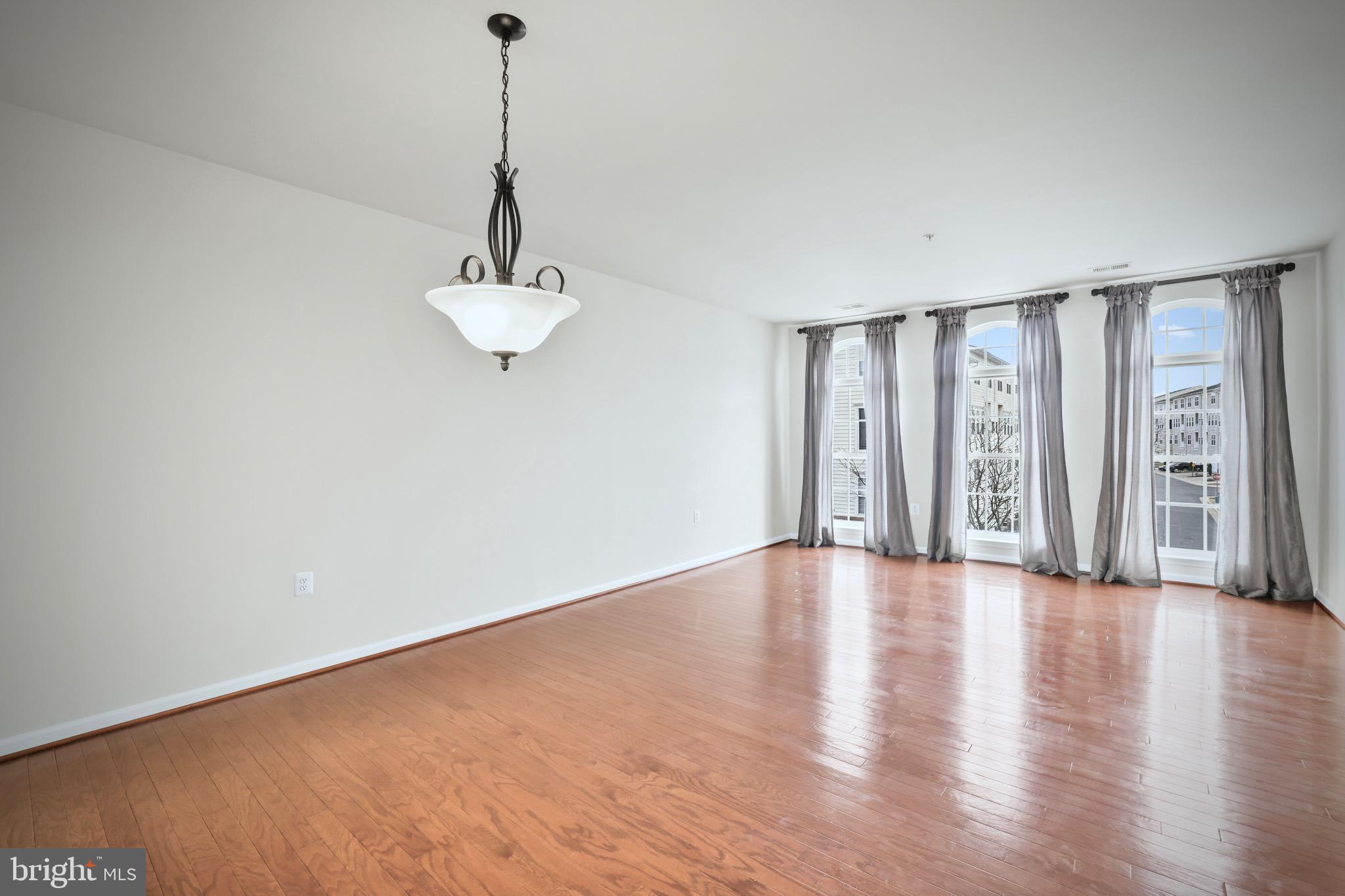 6055 Wicker Lane, Unit 128 Centreville, VA 20121 - Photo 9 of 36 a view of an empty room with a window