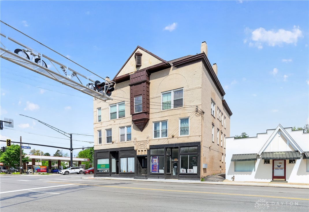 7045-7049 Montgomery Road Cincinnati, OH 45236 - Photo 2 of 68 This classic brick building offers retail space and residential units, perfect for urban living and business.