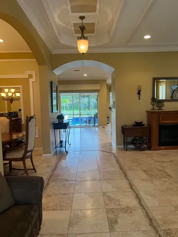 a lobby with furniture and a fireplace