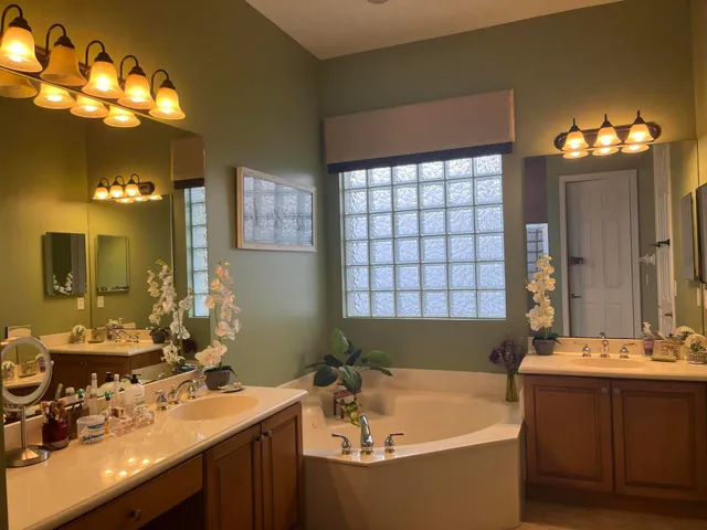 a bath tub sitting in a bathroom and sink