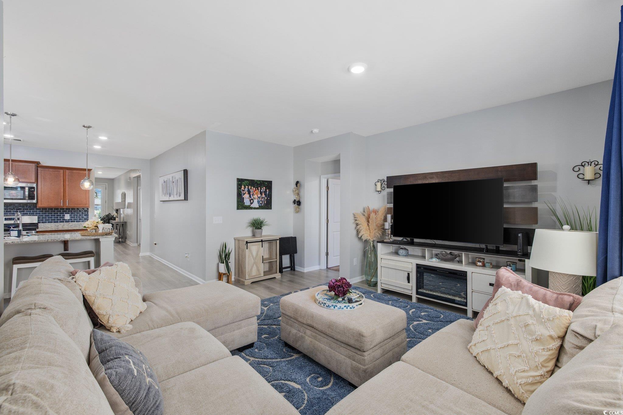 6009 Ranch View Drive Myrtle Beach, SC 29588 - Photo 11 of 40 Living area featuring recessed lighting, baseboards, and light wood-style flooring