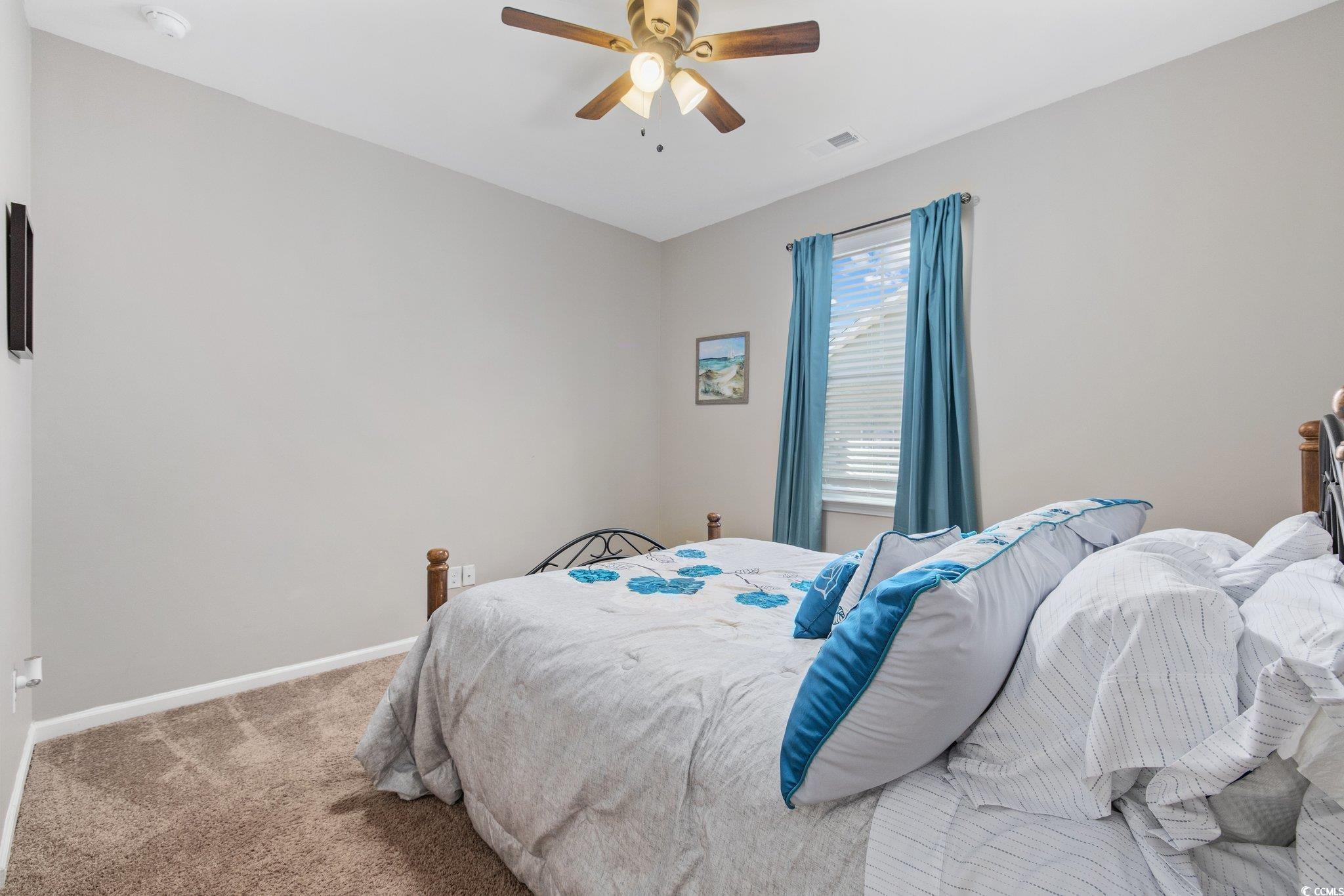 6009 Ranch View Drive Myrtle Beach, SC 29588 - Photo 25 of 40 Bedroom with carpet flooring, visible vents, baseboards, and ceiling fan