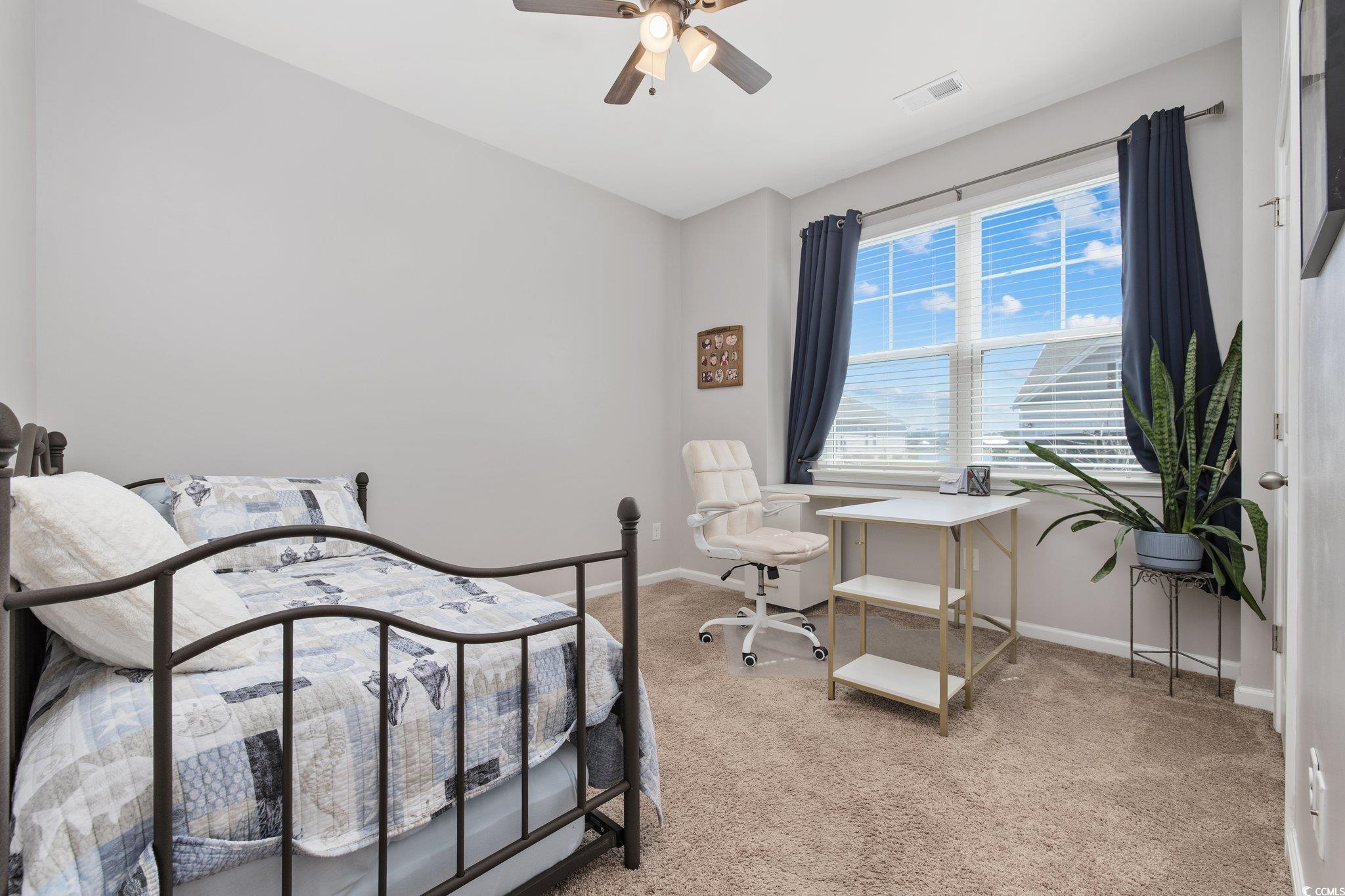 6009 Ranch View Drive Myrtle Beach, SC 29588 - Photo 26 of 40 Bedroom featuring a ceiling fan, light colored carpet, visible vents, and baseboards