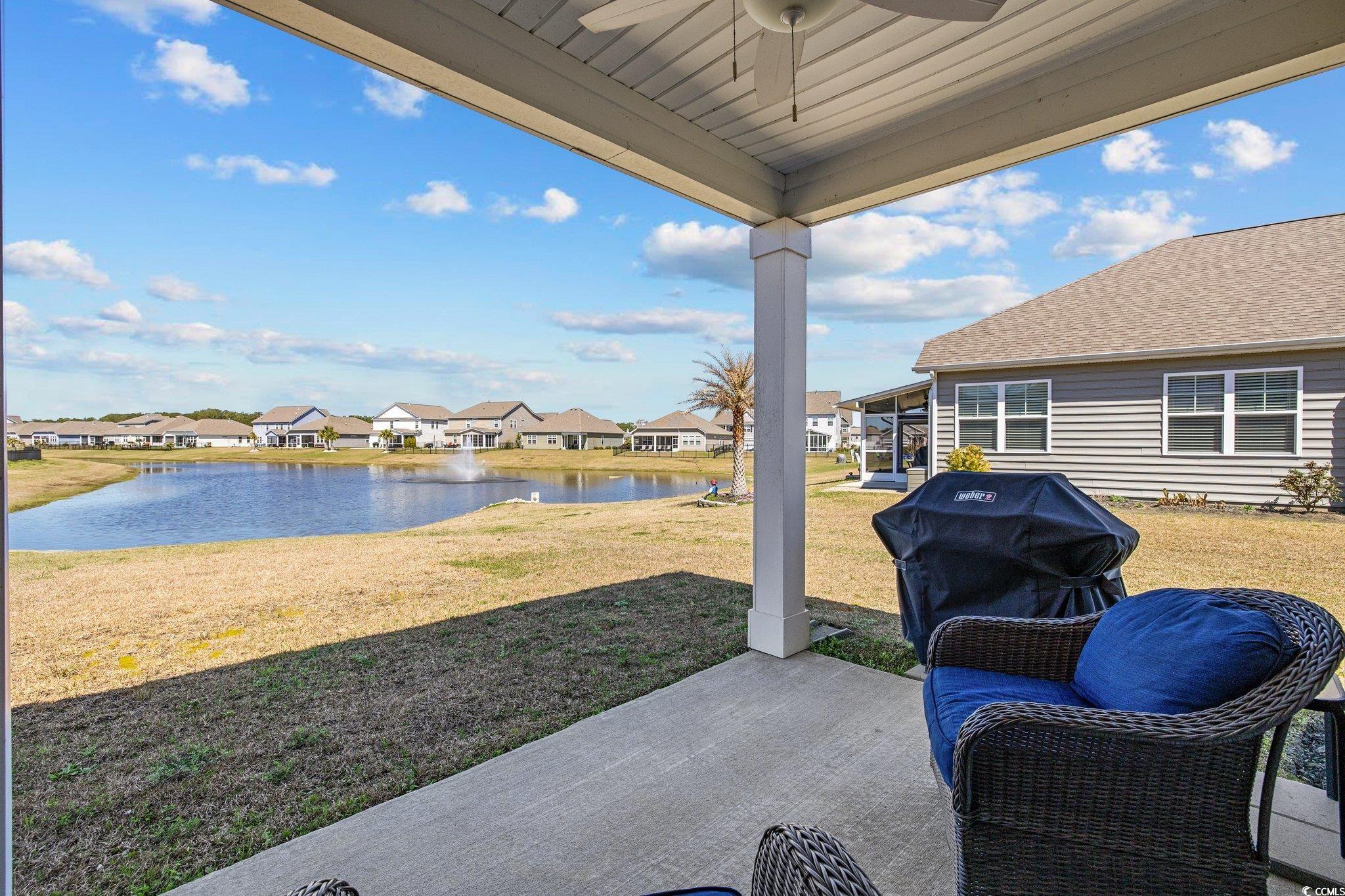 6009 Ranch View Drive Myrtle Beach, SC 29588 - Photo 28 of 40 View of patio / terrace with a residential view, area for grilling, ceiling fan, and a water view