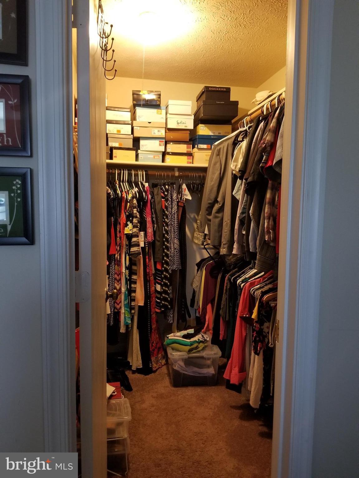 44 Buck Road Stafford, VA 22556 - Photo 12 of 30 a view of walk in closet with clothes and shoes