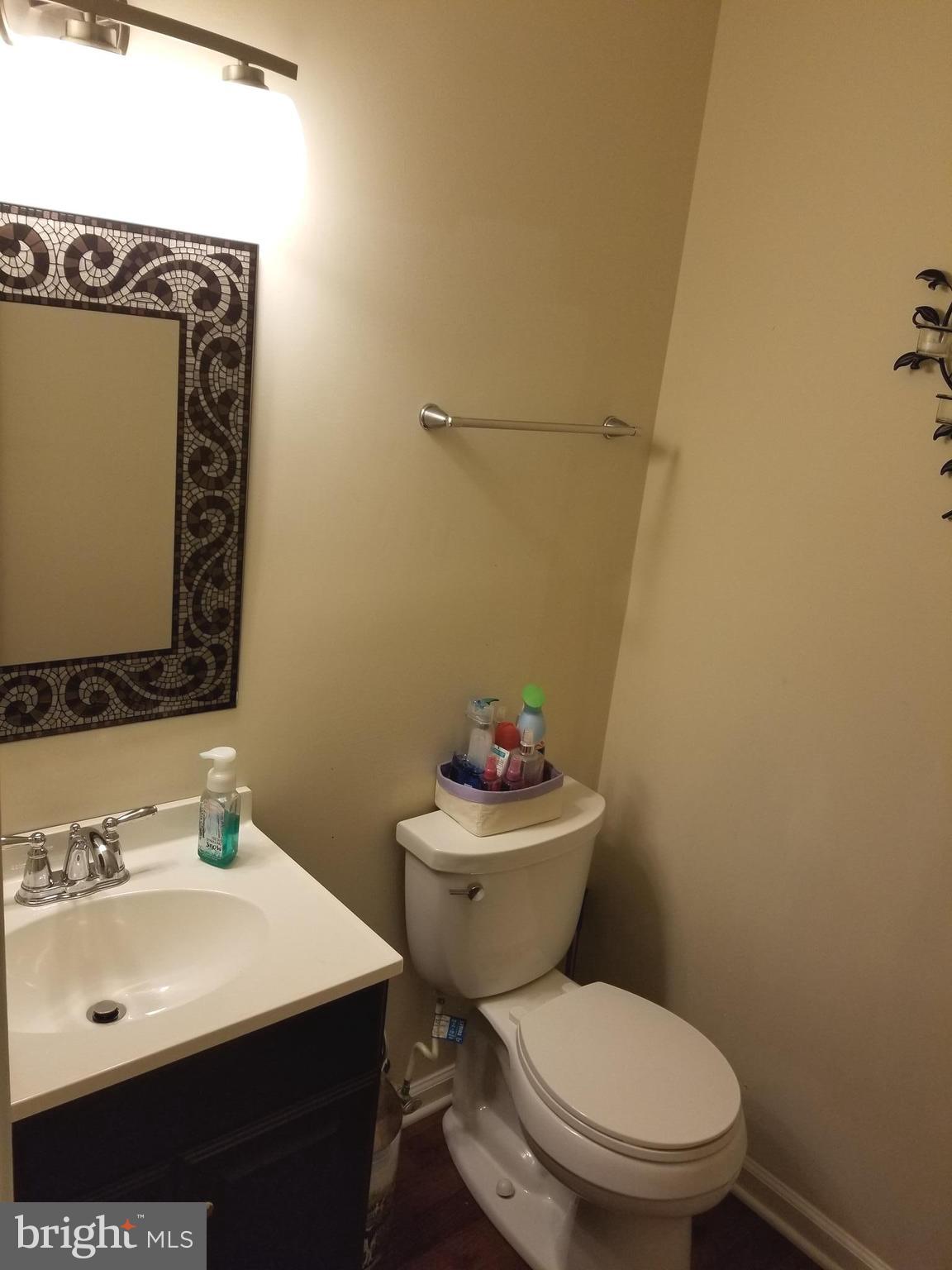 44 Buck Road Stafford, VA 22556 - Photo 3 of 30 a white toilet sitting next to a bathroom sink