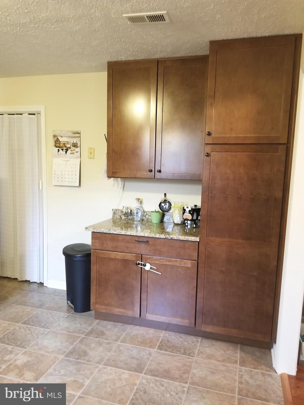 44 Buck Road Stafford, VA 22556 - Photo 5 of 30 a bathroom with a granite countertop sink and a mirror