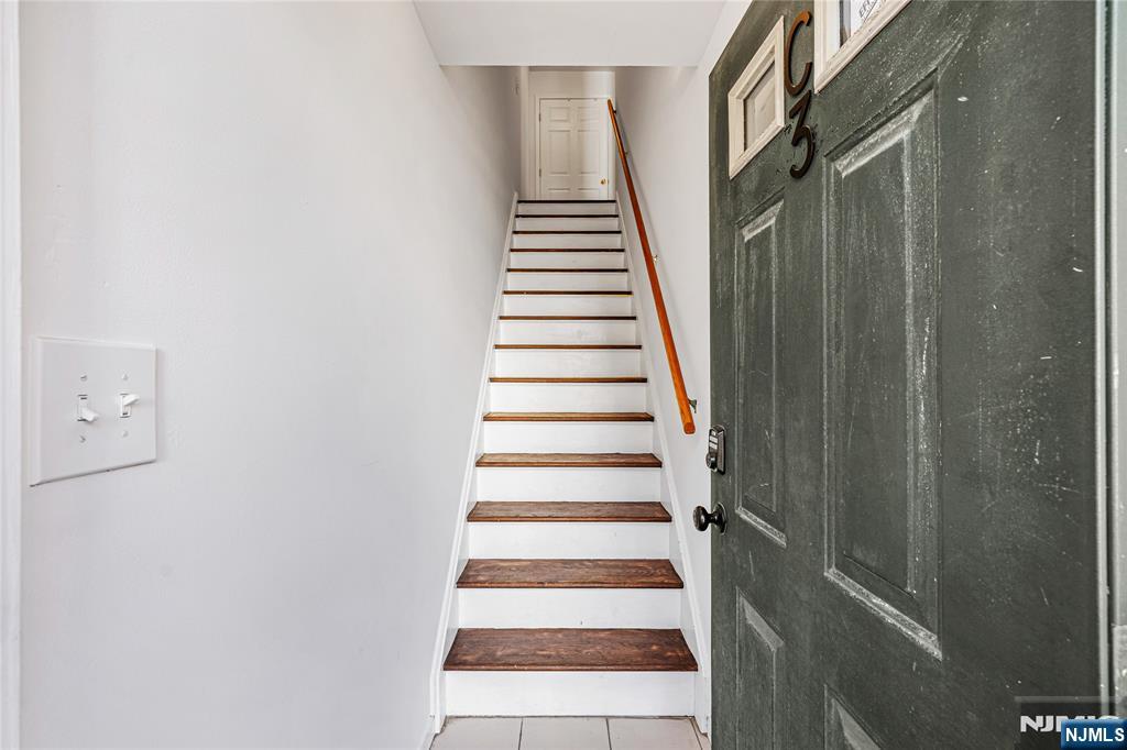 84 Union Street Newark, NJ 07105 - Photo 36 of 39 a view of a hallway with stairs and a white door