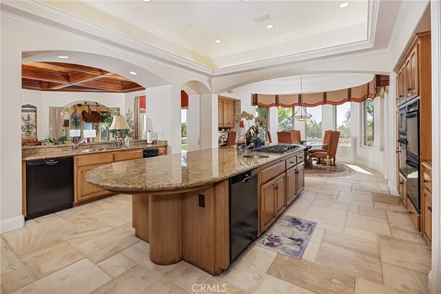 a view of a room with furniture and chandelier