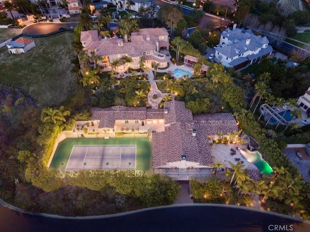 an aerial view of a house with yard swimming pool and outdoor seating