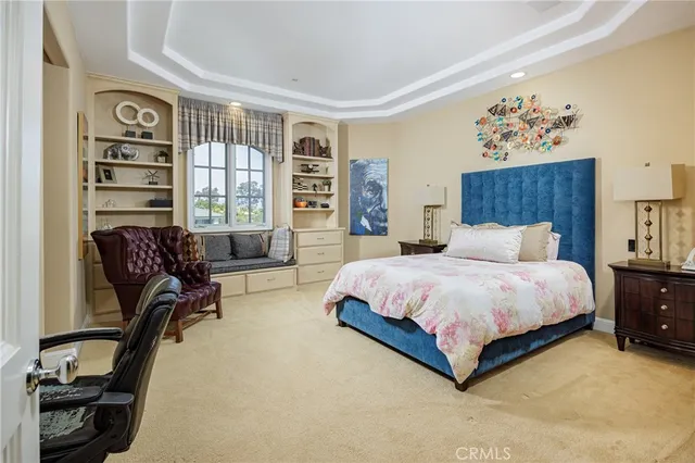 a dining hall with lots of furniture and a large window