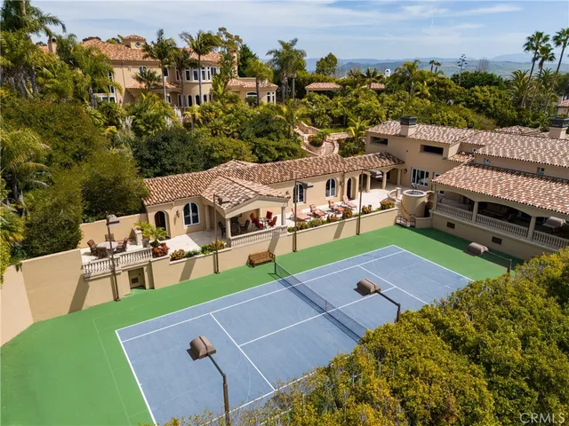 a view of a kitchen area with furniture and wooden floor