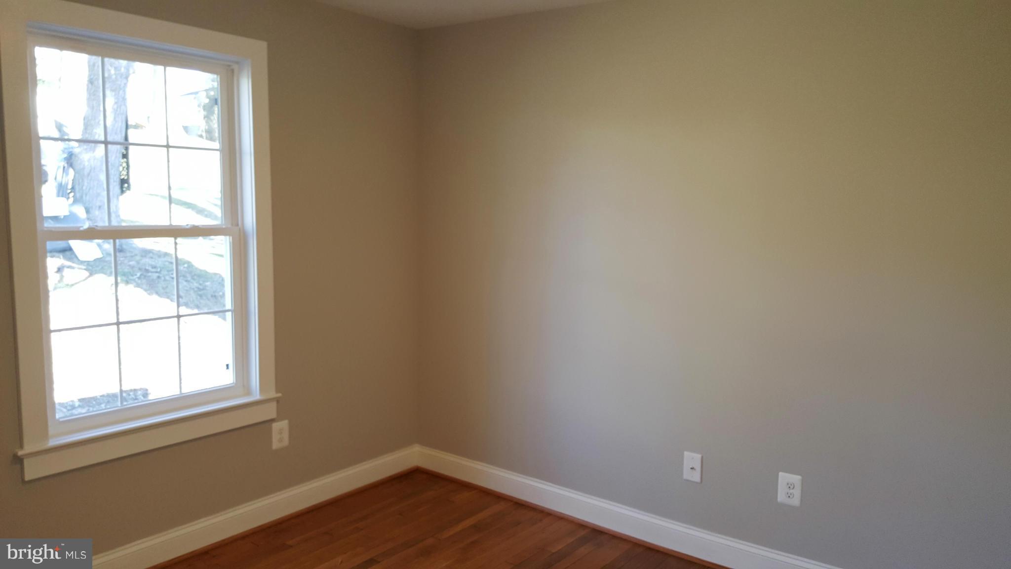 12101 Berry Street Silver Spring, MD 20902 - Photo 15 of 27 an empty room with wooden floor and windows