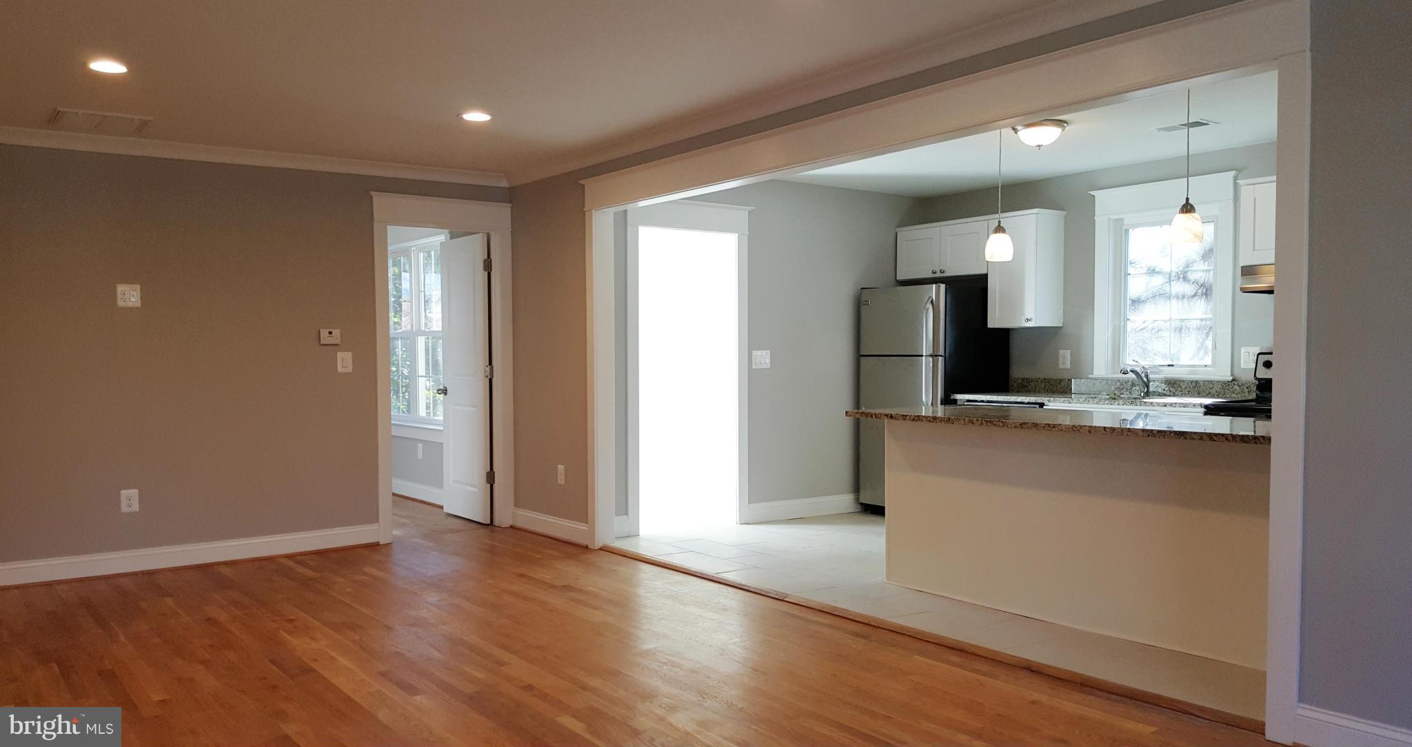 12101 Berry Street Silver Spring, MD 20902 - Photo 27 of 27 a view of a kitchen cabinets and a wooden floor