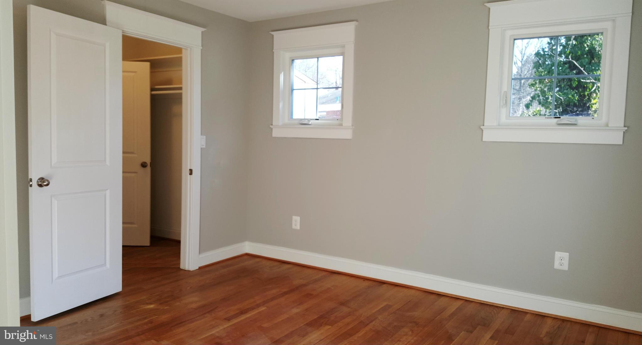 12101 Berry Street Silver Spring, MD 20902 - Photo 5 of 27 an empty room with wooden floor and windows