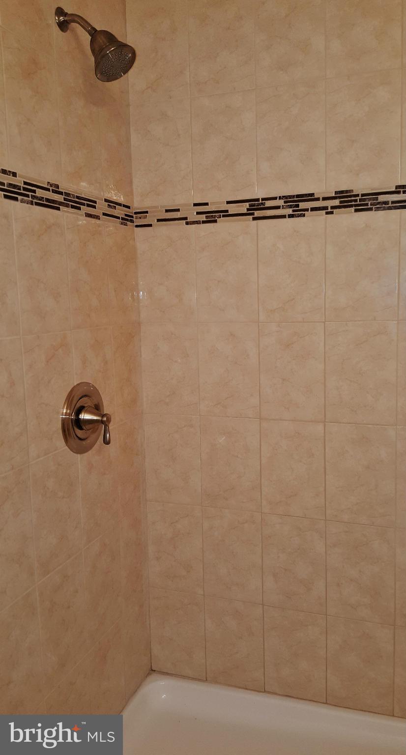 12101 Berry Street Silver Spring, MD 20902 - Photo 8 of 27 a bathroom with a shower