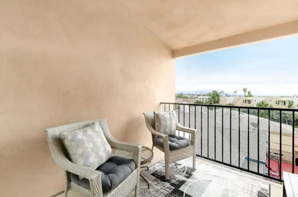 a view of a chairs and table on the terrace