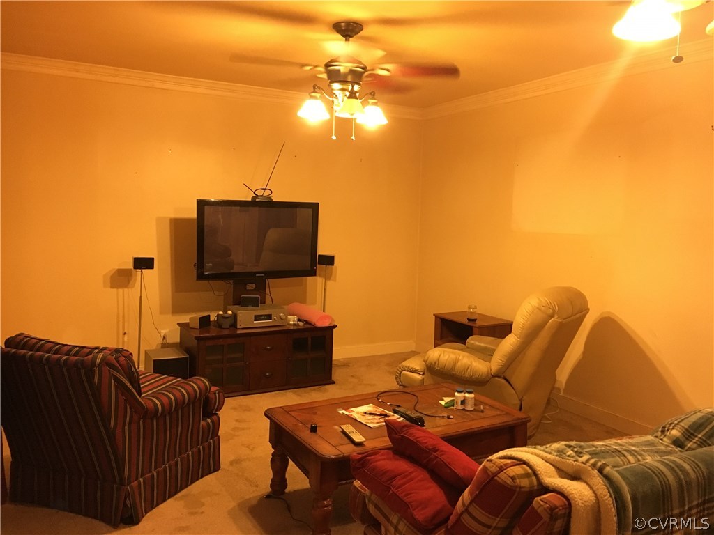 413 Bermuda Hundred Road Chester, VA 23836 - Photo 8 of 12 a living room with furniture a flat screen tv and a lamp