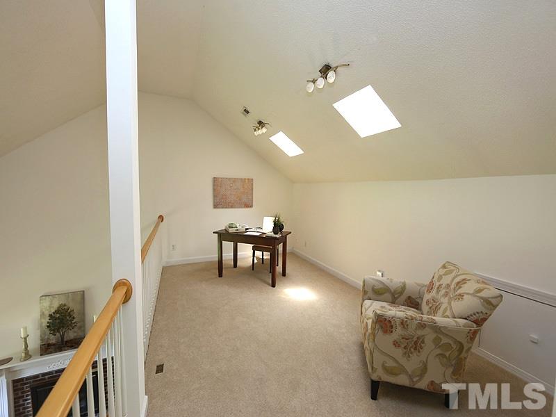 6825 Pinnacle Ridge Road Raleigh, NC 27603 - Photo 11 of 23 a living room with furniture and a piano