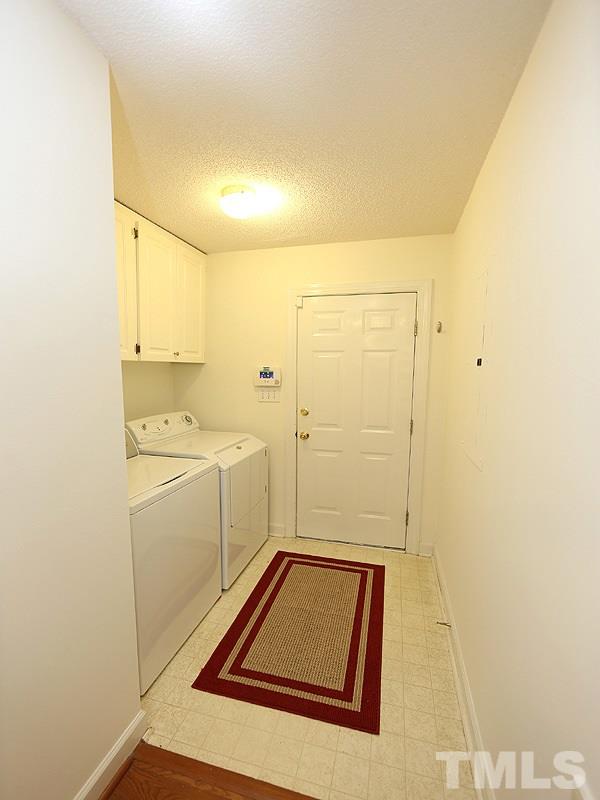 6825 Pinnacle Ridge Road Raleigh, NC 27603 - Photo 12 of 23 a room with storage and utility