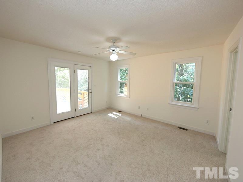 6825 Pinnacle Ridge Road Raleigh, NC 27603 - Photo 13 of 23 a view of an empty room with a window