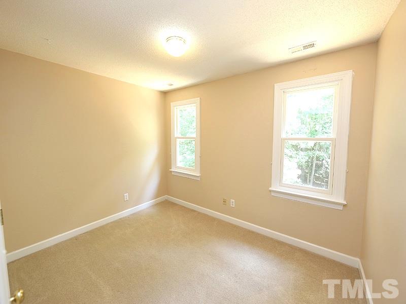 6825 Pinnacle Ridge Road Raleigh, NC 27603 - Photo 17 of 23 an empty room with windows