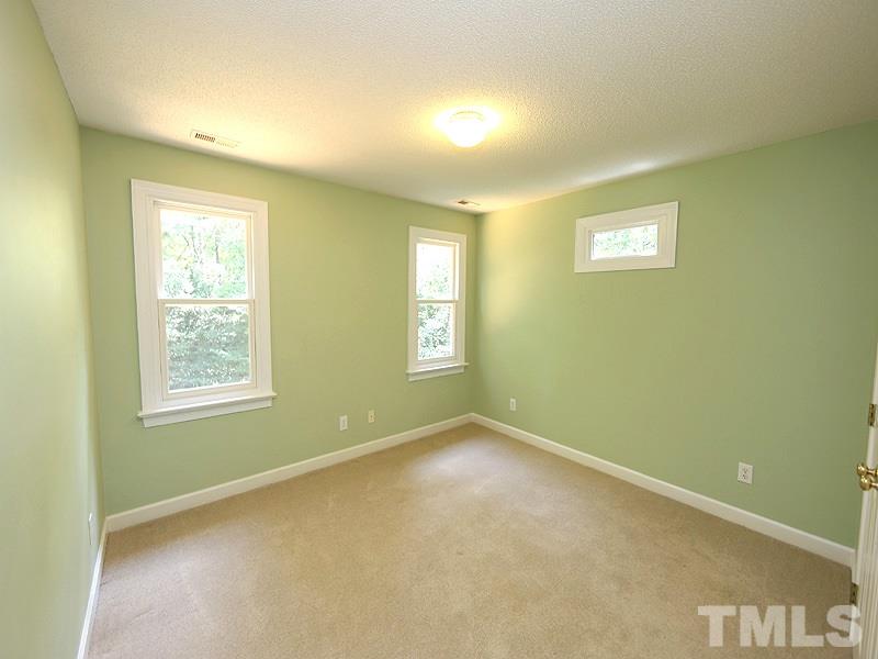 6825 Pinnacle Ridge Road Raleigh, NC 27603 - Photo 18 of 23 a view of an empty room with a window