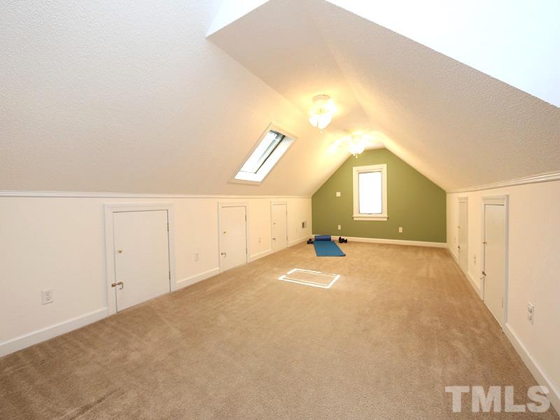 6825 Pinnacle Ridge Road Raleigh, NC 27603 - Photo 20 of 23 a view of a big room with closet and windows