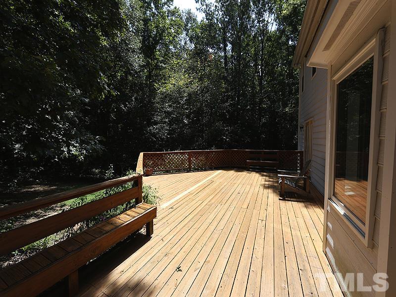 6825 Pinnacle Ridge Road Raleigh, NC 27603 - Photo 22 of 23 a view of a balcony with wooden floor and outdoor space