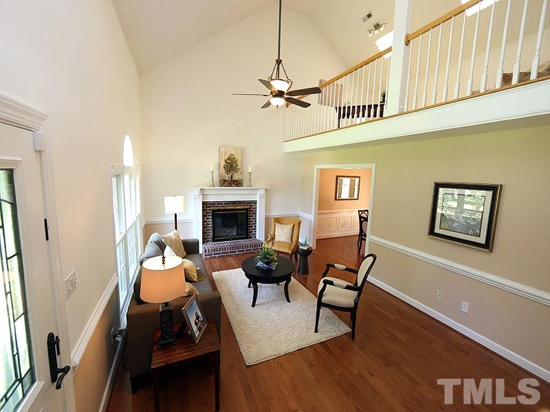 6825 Pinnacle Ridge Road Raleigh, NC 27603 - Photo 4 of 23 a living room with furniture and a fireplace