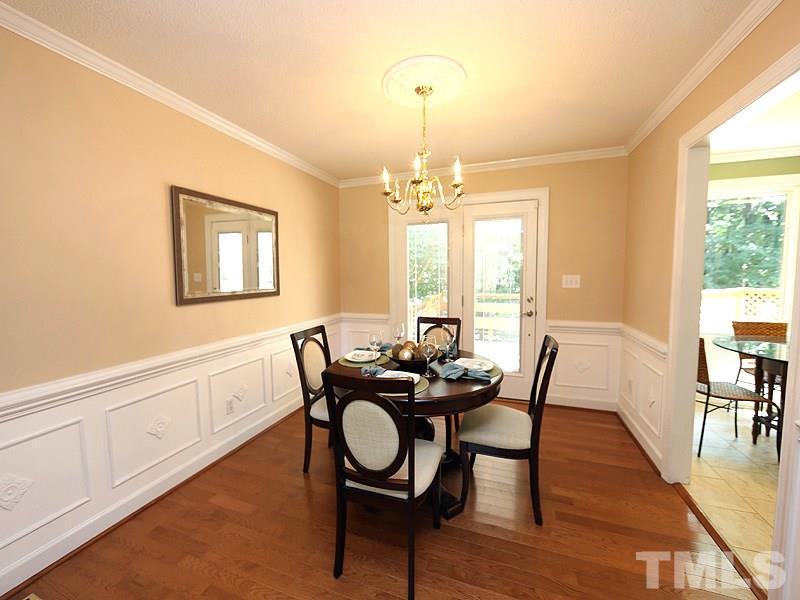 6825 Pinnacle Ridge Road Raleigh, NC 27603 - Photo 6 of 23 a view of a dining room with furniture and wooden floor