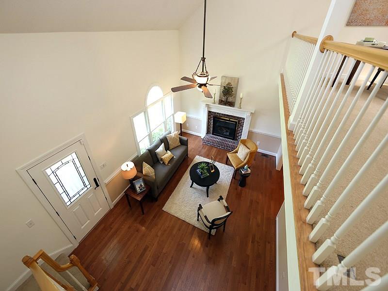 6825 Pinnacle Ridge Road Raleigh, NC 27603 - Photo 7 of 23 a view of a livingroom with wooden floor and a window