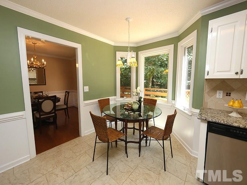 6825 Pinnacle Ridge Road Raleigh, NC 27603 - Photo 10 of 23 a view of a dining room with furniture window and outside view