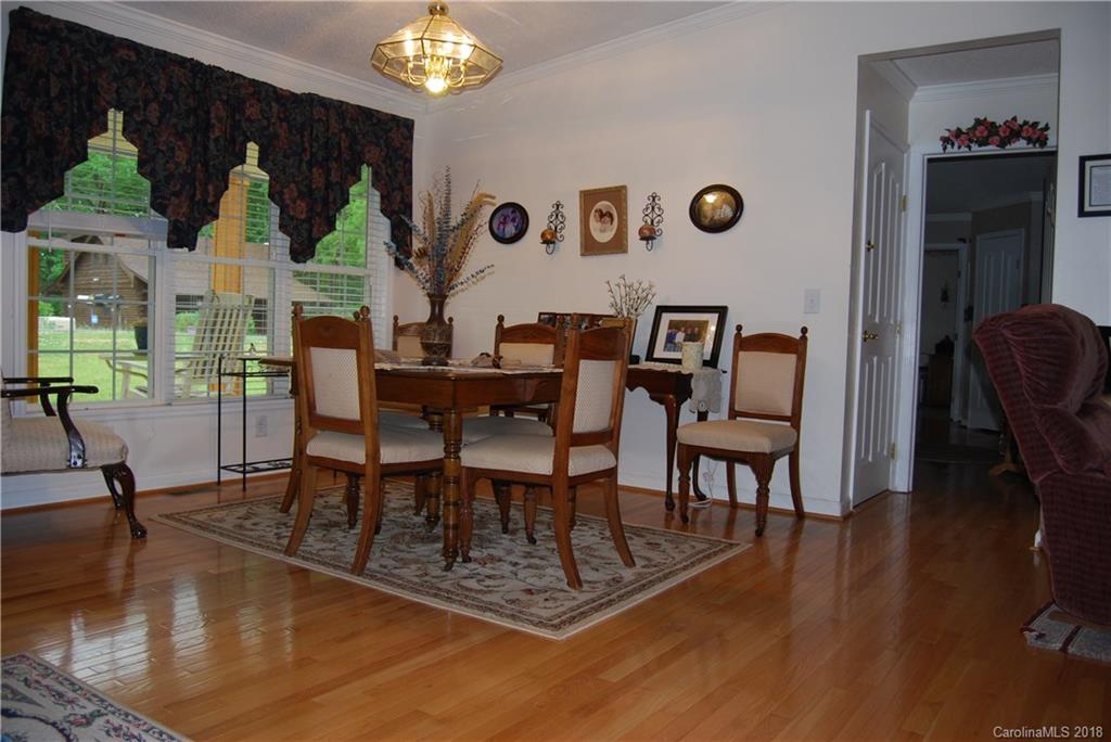 100 Hampton Road, Unit 13 Leicester, NC 28748 - Photo 4 of 33 a view of a dining room with furniture window and wooden floor