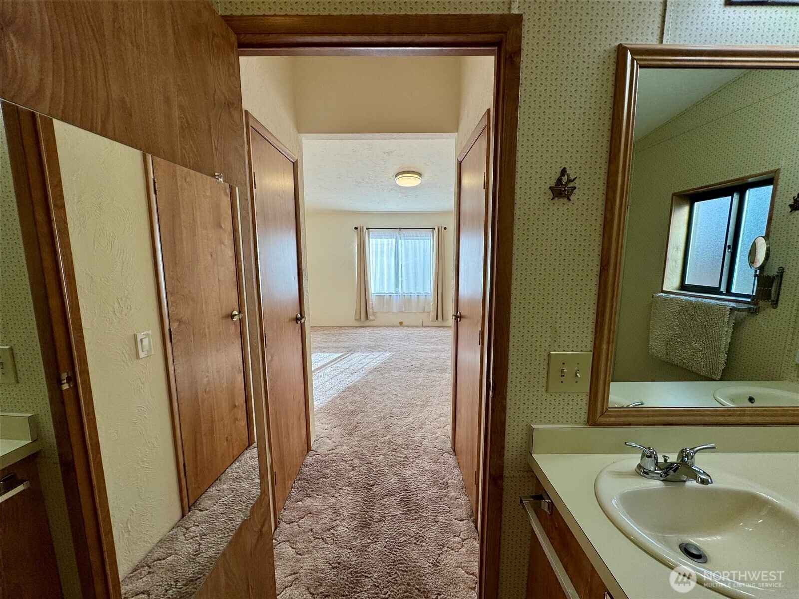 120 Fircrest Drive Sequim, WA 98382 - Photo 11 of 32 a bathroom with a sink a mirror and a shower