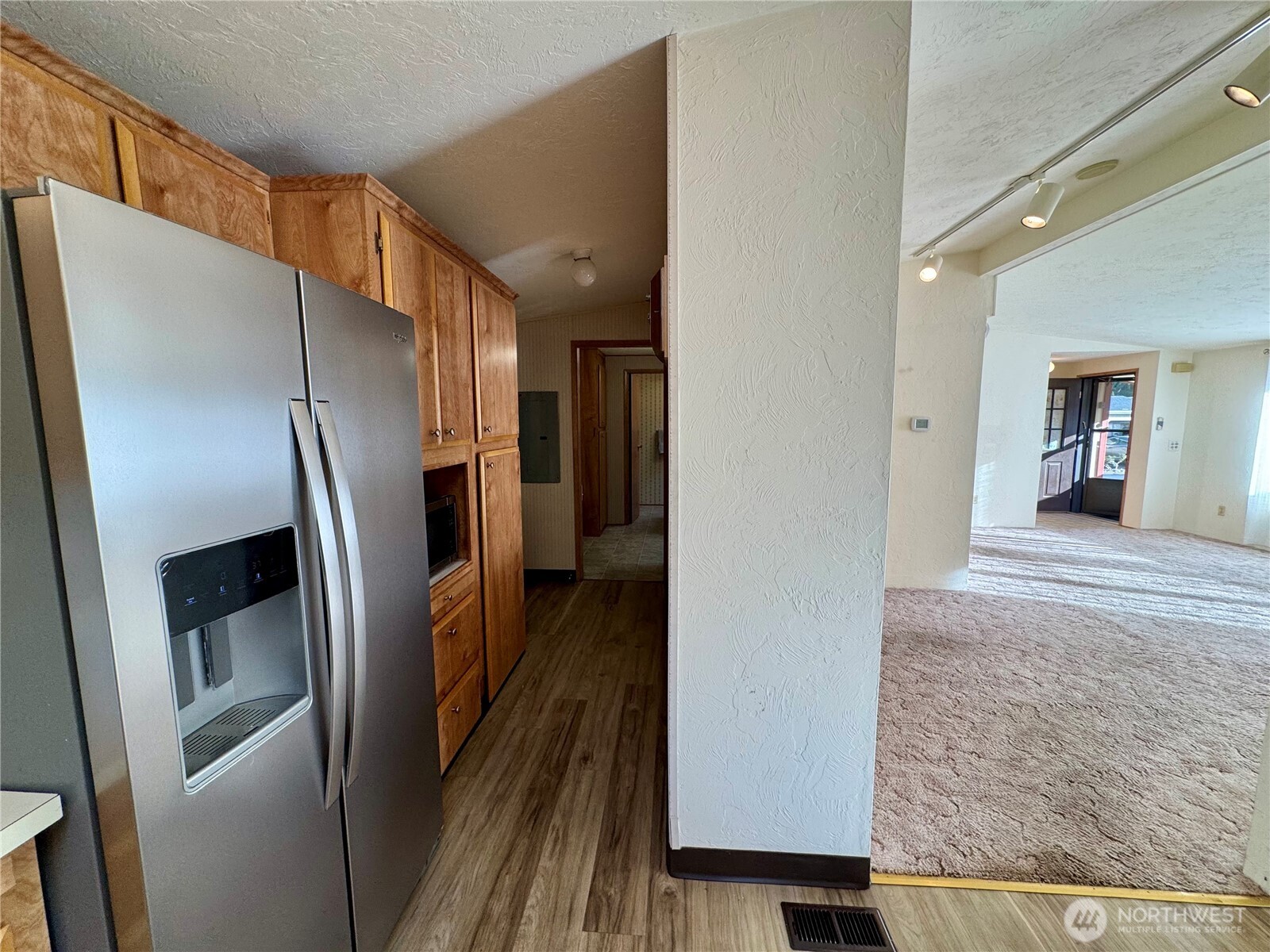 120 Fircrest Drive Sequim, WA 98382 - Photo 18 of 32 a view of a refrigerator in kitchen and an empty room
