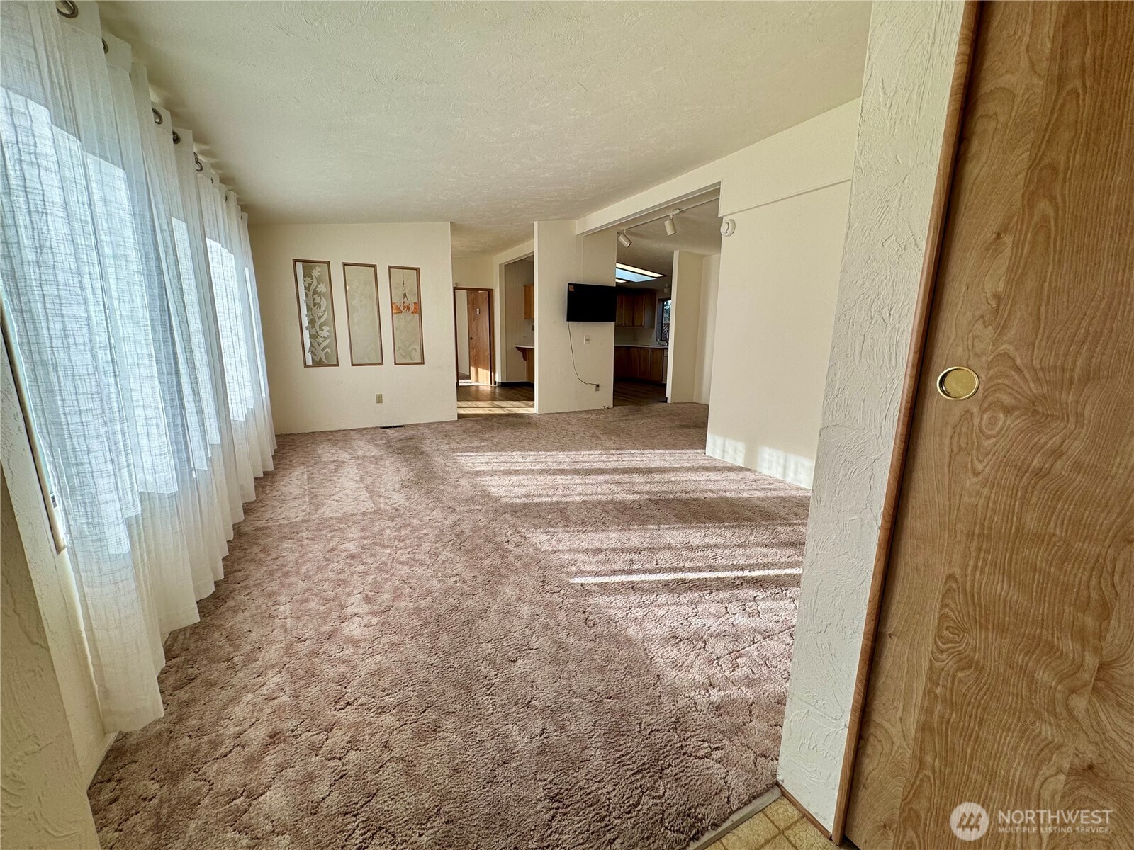 120 Fircrest Drive Sequim, WA 98382 - Photo 4 of 32 a view of a house with wooden floor and a window
