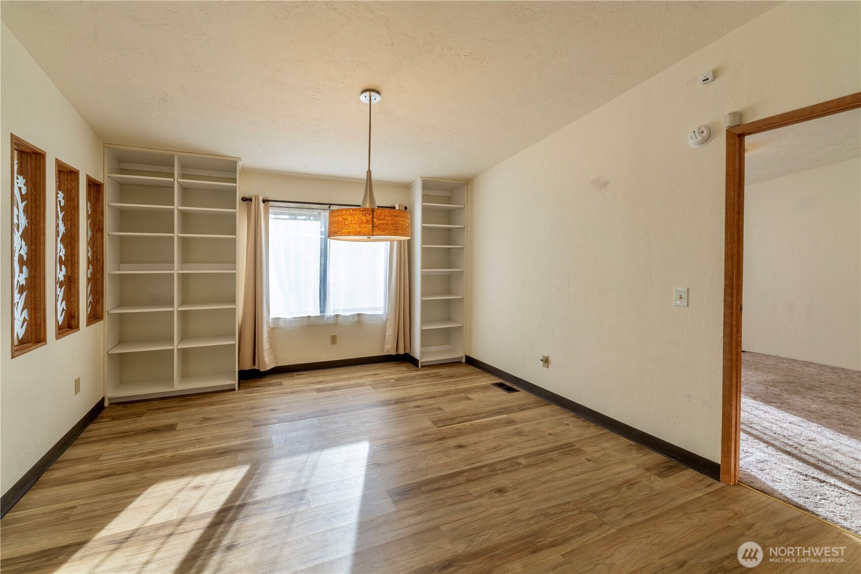 120 Fircrest Drive Sequim, WA 98382 - Photo 8 of 32 a view of empty room with wooden floor and fan