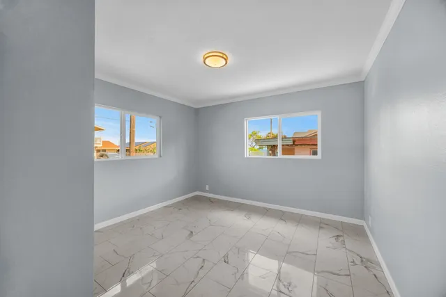 a bedroom with a bed and a lamp