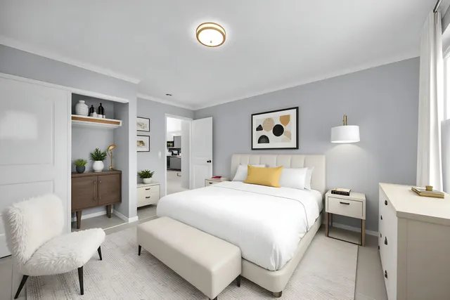 an empty room with an entryway and closet area