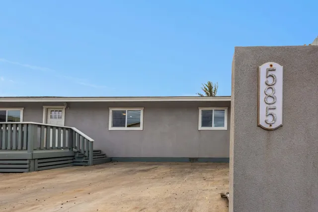 a view of backyard with deck