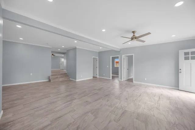 a view of room with window and ceiling fan