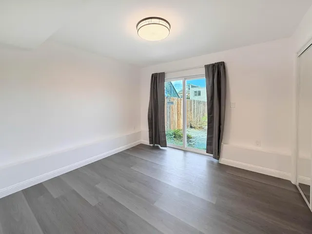 a bathroom with a toilet sink and a mirror