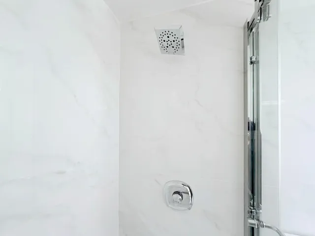 a kitchen with cabinets and wooden floors