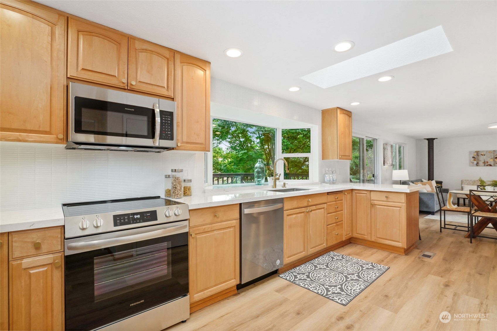 24113 10th Place West Bothell, WA 98021 - Photo 15 of 35 a kitchen with a sink stove and microwave