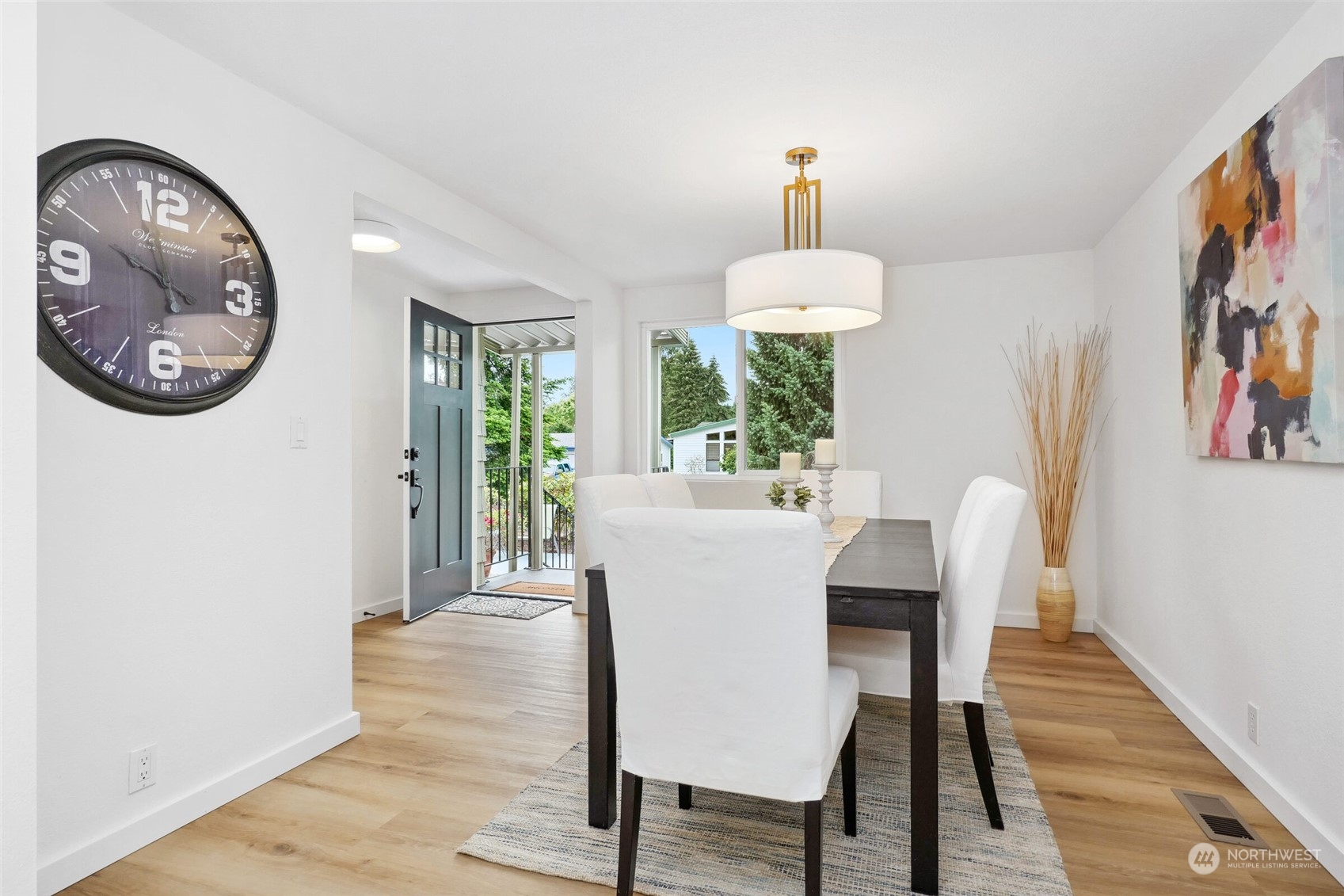 24113 10th Place West Bothell, WA 98021 - Photo 20 of 35 a view of a dining room with furniture a chandelier and wooden floor