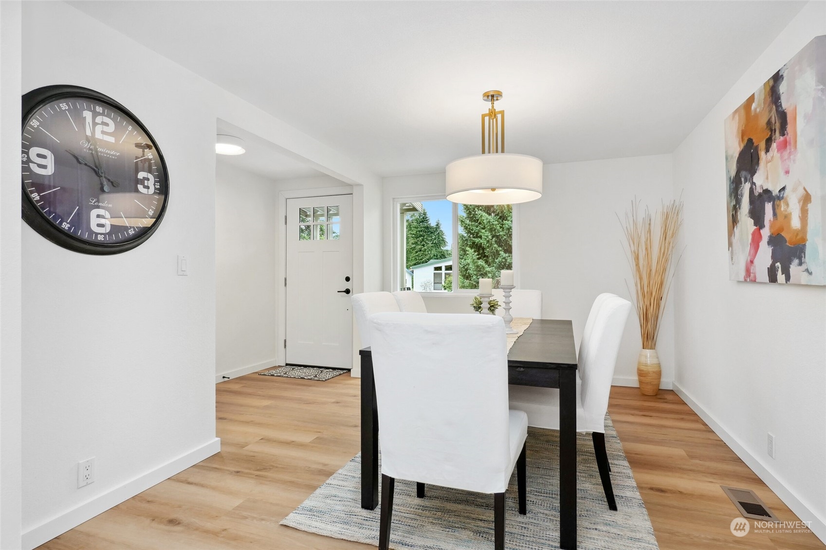 24113 10th Place West Bothell, WA 98021 - Photo 21 of 35 a view of a dining room with furniture and a chandelier
