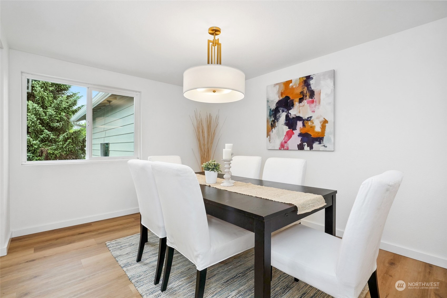 24113 10th Place West Bothell, WA 98021 - Photo 22 of 35 a view of a dining room with furniture and wooden floor