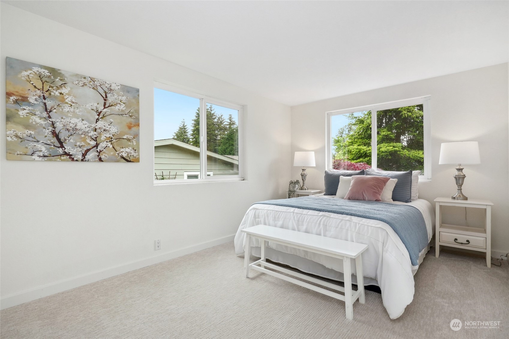 24113 10th Place West Bothell, WA 98021 - Photo 26 of 35 a bed sitting in a bedroom next to a window