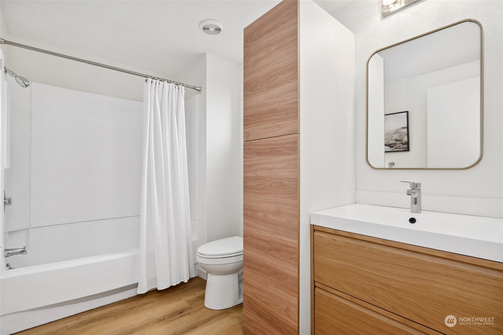 24113 10th Place West Bothell, WA 98021 - Photo 27 of 35 a bathroom with a bathtub shower sink vanity and toilet